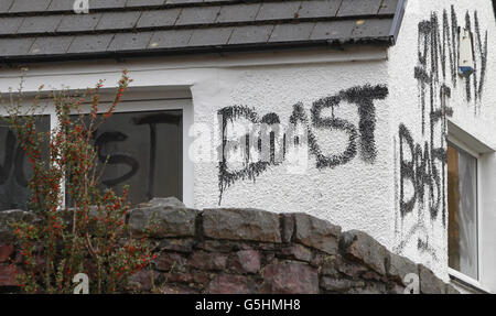 Slogans painted on the cottage owned by Jimmy Savile in Glencoe, Scotland. Stock Photo