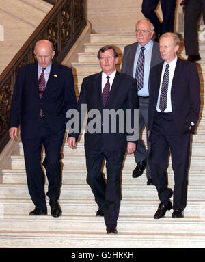 Ulster Unionist Leader David Trimble (centre) with his four ministers (from left) Arts Minister Michael McGimpsey, Environment Minister Sam Foster and acting first minister Sir Reg Empey, before talking to the waiting media at Stormont, near Belfast. * ........ Mr Trimble announced that UPP ministers will quit the Northern Ireland power-sharing executive with the hope that it will force the IRA to start decommissioning their weapons. Stock Photo