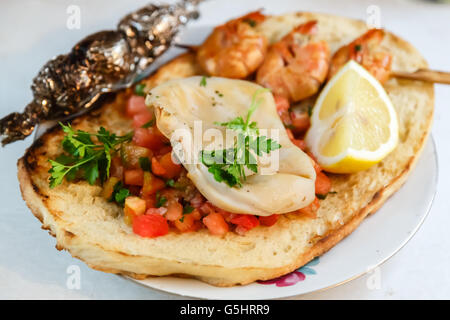 Extreme close up of appetizing grilled queen prawn tail brochettes. Stock Photo