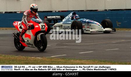 20-Jul-95 ... F1 car v GP 500 Bike ... Ukyo Katayama in the Tyrrell F1 car challenges Norifumi Abe on the Roberts GP 500 bike at Donington Stock Photo