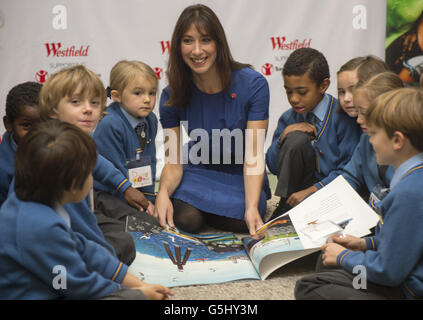 Samantha Cameron, wife of the Prime Minister David Cameron, meets children from the Larmenier & Sacred Heart Catholic School (who are competing in the annual choir competition to raise funds for Save the Children) to read 'The Snail and the Whale' as part of a series of fundraising events for 'Save the Children' at Foyles in Westfield, London. Stock Photo