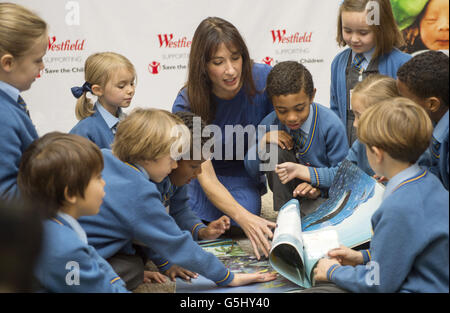 Samantha Cameron, wife of the Prime Minister David Cameron, meets children from the Larmenier & Sacred Heart Catholic School (who are competing in the annual choir competition to raise funds for Save the Children) to read 'The Snail and the Whale' as part of a series of fundraising events for 'Save the Children' at Foyles in Westfield, London. Stock Photo