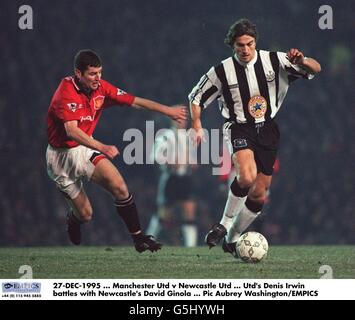 27-DEC-1995, Manchester United v Newcastle United, United's Denis Irwin battles with Newcastle's David Ginola Stock Photo