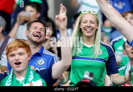 Northern Ireland fans cheer on their side in the stands before the UEFA Euro 2016, Group C match at the Parc Des Princes, Paris. PRESS ASSOCIATION Photo. Picture date: Tuesday June 21, 2016. See PA story SOCCER N Ireland. Photo credit should read: Owen Humphreys/PA Wire. Stock Photo