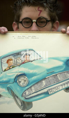 Harry Potter lookalike David Parry from Wolverhampton gets his hands on a piece of original watercolour cover artwork from the book Harry Potter And The Chamber Of Secrets at Christie's in London. * .... The artwork is one of three pieces which are expected to fetch in excess of 30,000 and is being auctioned during the Original Book Illustrations sale. Stock Photo