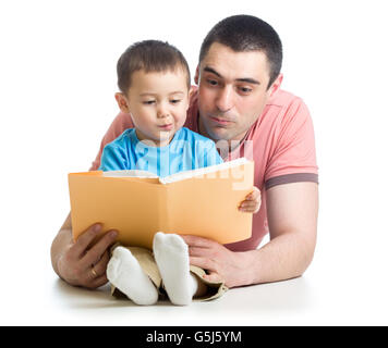 kid boy and father read a book on floor at home Stock Photo