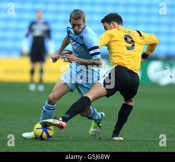 Soccer - FA Cup - First Round - Coventry City v Arlesey Town - Ricoh Arena. Coventry City's Carl Baker and Arlesey Town's Chris Dillon during the FA Cup First Round match at the Ricoh Arena, Coventry. Stock Photo