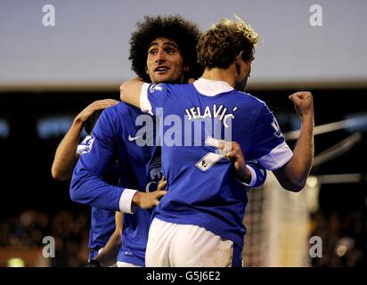 Everton's Marouane Fellaini (left) celebrates with team-mate Nikica Jelavic after scoring his side's second goal of the game Stock Photo