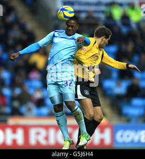 Soccer - FA Cup - First Round - Coventry City v Arlesey Town - Ricoh Arena. Coventry City's Franck Moussa and Arlesey Town's Chris Dillon during the FA Cup First Round match at the Ricoh Arena, Coventry. Stock Photo