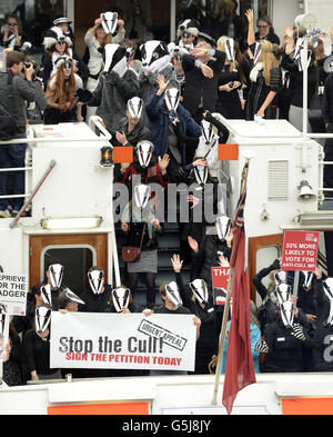 Activists from the League Against Cruel Sports stage a protest against proposed badger culls aboard the Thames Princess, Westminster, London. Stock Photo