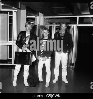 The three-man pop group Police leaving Heathrow for Barbados. Left to right: Gordon Sumner, better known as Sting, Andy Summers and Stewart Copeland. Stock Photo