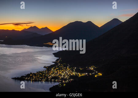 Maya Nose, or Indian Nose is a lookout over Lago Atitlan in Guatemala.  The Volcanic lake is rimmed by Mayan Villages and towns Stock Photo