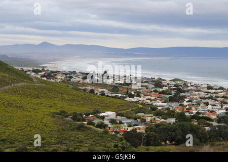 Aerial view of the Eastern suburbs of Hermanus (South Africa) surrounding Fernkloof, with Walker Bay in the background Stock Photo