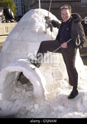 Former Chief Executive of the Millennium Dome PY Gerbeau scales an icey igloo in London's Trafalgar Square. PY was launching 'Xscape' his new indoor winter sports facility in Milton Keynes. Stock Photo