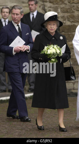 Britain's Queen Elizabeth II, accompanied by the Prince of Wales, about to lay a wreath on the Rememberance Stone outside Westminster Abbey in London, following a memorial service to those who died in the September 11th terrorist attacks in New York. Stock Photo