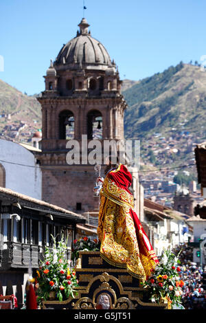 San Antonio Abad float and crowd, La Merced Church in background, Plaza de Armas, Corpus Christi Celebration, Cusco, Peru Stock Photo