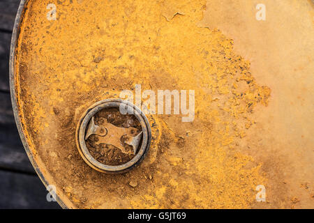 Old metal gasoline container on a wooden floor. Stock Photo