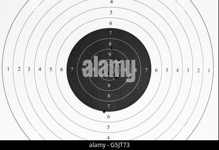 Used paper target with bullet holes. Stock Photo