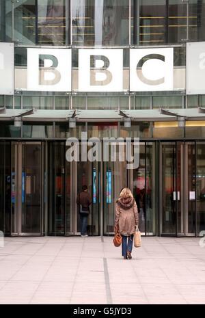 BBC staff arrive at New Broadcasting house in central London as the BBC's director of news, Helen Boaden, and her deputy, Stephen Mitchell, have stepped aside just two days after the resignation of director-general George Entwistle. Stock Photo