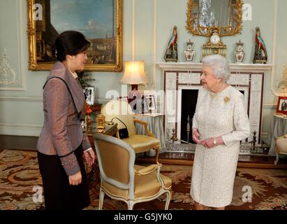 Queen Elizabeth II talks with the Prime Minister of Thailand Mrs Yingluck Shinawatra, during a private audience at Buckingham Palace in central London. Stock Photo