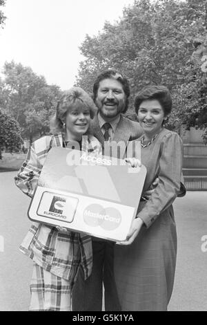 BBC Radio One DJ Dave Lee Travis poses with Alice Clark (left) and Elizabeth Stead, two of the finalists in the Access Assistant of the Year competition. Stock Photo