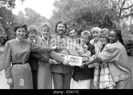 BBC Radio One DJ Dave Lee Travis poses with the finalists in the Access Assistant of the Year competition. (l-r) Elizabeth Stead, Margaret Watts, Emily Parker, Angus Mackenzie, Lynn Bannard, Dorothy McGall, Alice Clarke and Tina Bangs. Stock Photo