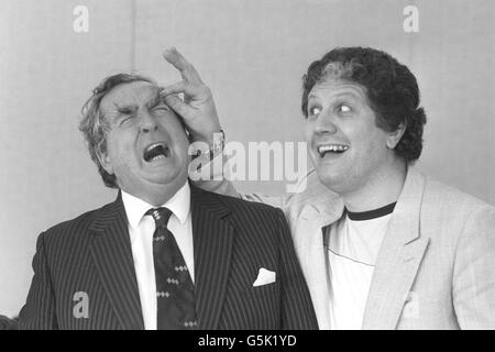 DJ Dave Lee Travis pulls the famous eyebrows of Shadow Foreign Secretary Denis Healey as they entertain children at the House of Commons. Stock Photo
