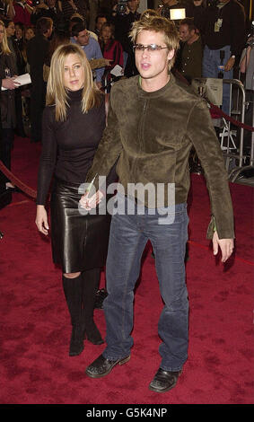 Brad Pitt and his wife Jennifer Aniston, arriving at the Mann National Theatre in Los Angeles, USA, for the Premiere of his latest film Spy Game. lllll Stock Photo