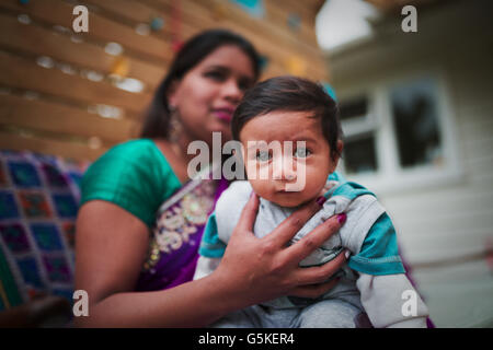 Indian woman holding baby son Stock Photo