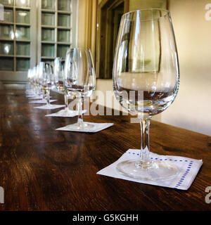 Wine glasses ready for a party on top of rustic table Stock Photo