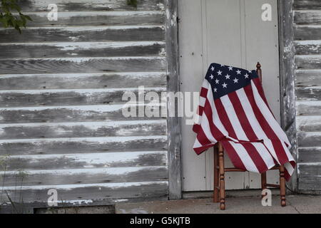 American flag with swastika on cement with barn lumber Stock Photo