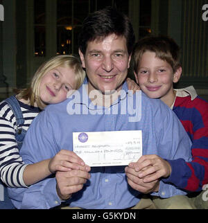 Robert Brydges the latest jackpot winner on Who Wants To Be A Millionaire? with his son Kempe, 10, and daughter Catherine, nine, holding the 1 million pound cheque at a press conference in London. * Mr Brydges, 47, of Holland Park, west London, became the fourth million pound winner of the show, which is due to be transmitted on 29/9/01. Stock Photo