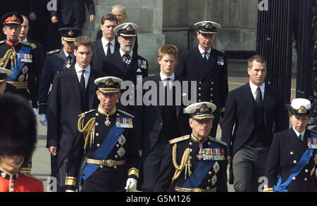 Members of the Royal family follow the coffin of Queen Elizabth the Queen Mother as it passes into Whitehall during the cermeonial procession, which saw it carried from the Queen's Chapel at St James's Palace to Westminster Hall. * where it will Lie-in-State until the funeral. including, from left: the Duke of Kent, the Duke of Gloucester, Prince William, Prince William, the Prince of Wales, the Duke of Kent, Prince Harry, the Duke of Edinburgh, Commander Tim Laurence, Peter Phillips and the Princess Royal. Stock Photo