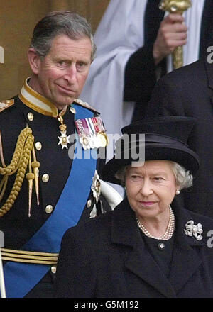 Queen Elizabeth II, right, leaves Westminster Hall followed by The Prince of Wales after the coffin of the Queen Mother was placed there to Lie-in-State. The funeral of the Queen Mother will take place on 9th April. Stock Photo