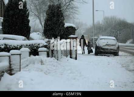 People battle through the blizzards in Spennymore in County Durham today after heavy snowfall as the winter weather continued across the UK. Stock Photo