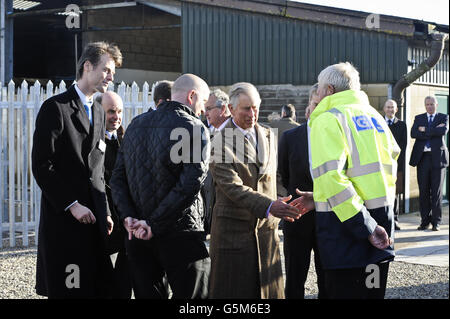 The Prince of Wales shakes hands with staff on his arrival at the Anaerobic Digester and Biomethane to Grid Plant at Rainbarrow Farm, Dorchester. Stock Photo