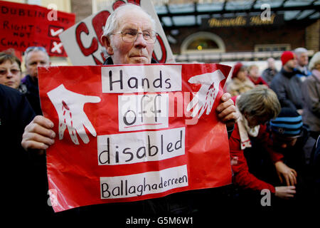 Protestors outside Leinster House, Dublin at the rally against proposed Government cuts to home help and carers of people with disabilities. Stock Photo