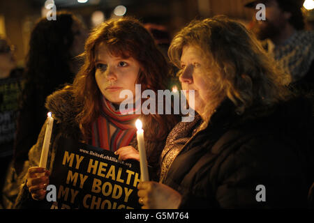 Protestors outside Leinster House, Dublin, in memory of Savita Halappanavar, who died on October 28, 17 weeks into her pregnancy after she miscarried and subsequently suffered septicaemia as her husband, Praveen Halappanavar, claims that doctors refused to carry out an abortion as a foetal heartbeat was present. Stock Photo