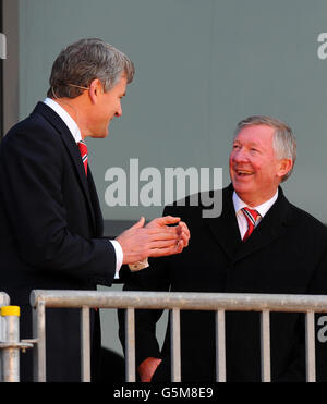 Sir Alex Ferguson (right) with David Gill before a statue of the Manchester United manager at was unveiled at Old Trafford, Manchester. Stock Photo