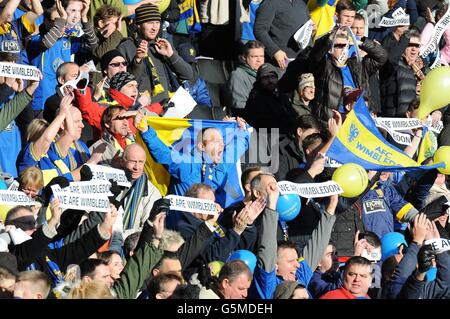 AFC Wimbledon fans show their vocal support for their team in the game against Milton Keynes Dons Stock Photo