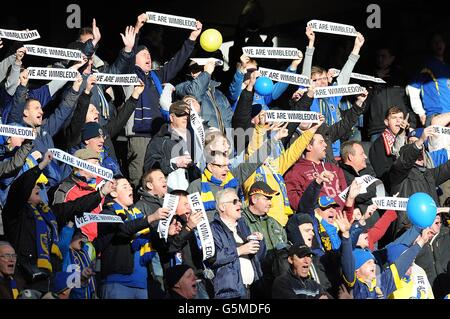 AFC Wimbledon fans show their support for their team with a message for Milton Keynes Dons fans, in the stands Stock Photo