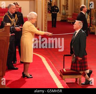 The Right Honourable Sir Malcolm Bruce from Banchory is knighted by Queen Elizabeth II during an Investiture ceremony at Buckingham Palace in central London. Stock Photo