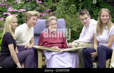 HRH Princess Alice (C) with her daughter-in-law the Duchess of Gloucester (2nd L) and her grandchildren, Lady Davina Windsor, 24 (L), Lady Rose Windsor, 21, (R) and Alexander the Earl of Ulster, 27 (2nd R). * Princess Alice, the Queen's aunt and dowager Duchess of Gloucester, is today celebrating her 100th birthday, her longevity is surpassed within the Royal Family only by the Queen Mother who is 17 months her senior. In this rare appearance the frail princess is pictured from earlier this year enjoying celebrations, in the gardens of her home in Kensington Palace, central London. On Stock Photo