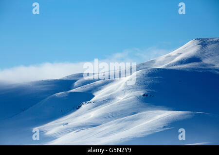 Snowy mountains in remote landscape Stock Photo