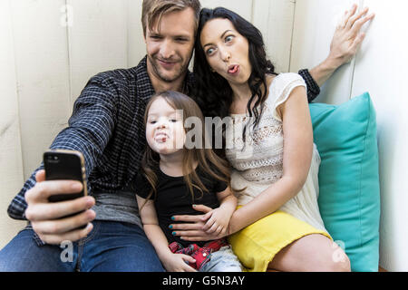Family taking selfie with cell phone Stock Photo