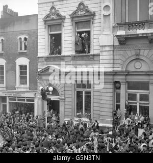 Chelsea Manager Dave Sexton drinks from the FA Cup in the window of Fulham Town Hall during Chelsea's victory parade following their FA Cup win over Leeds United. Stock Photo