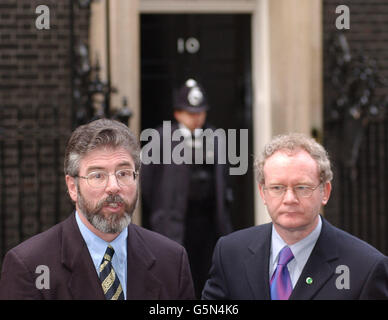 Sinn Fein's Martin McGuinness and Gerry Adams outside Downing Street in central London after they had talks with the British Prime Minister Tony Blair. * The pair, along with Sinn Fein MPs Michelle Gildernew and Pat Doherty are in London to take possession of offices at the House of Commons. Stock Photo