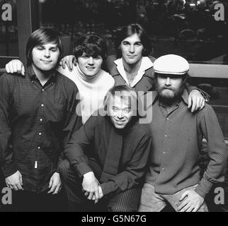 DECEMBER 4TH: The Beach Boys, the top American pop group, at a reception at the Hilton Hotel, London, soon after their arrival from America for an eleven day tour during which they will make television appearances. Left to right: Carl Wilson ( guitar, bass and drums), Bruce Johnston ( guitar), Dennis Wilson ( drums), Mike Love ( saxophone), and in front, centre, Al Jardine ( clarinet, bass and guitar). Stock Photo