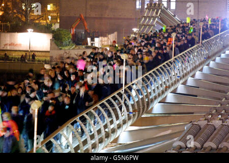 Around 2,000 people tried to make the Millennium Bridge wobble tonight, as engineers carried out a massive test on the structure. Architects, engineers and workers from surrounding offices were marshalled en masse across the bridge, * led by the Mayor of Southwark Hilary Wines to check on the success of repairs costing 5 million carried out since it was found to move too much. A series of 90 dampers, or shock absorbers, have been fitted to the 350-metres suspension bridge, which links the City of London and the South Bank of the Thames. Stock Photo