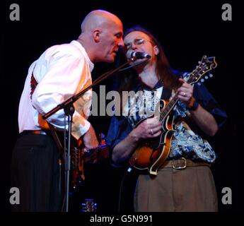 Dave Pegg (left) and Chris Leslie of Fairport Convention perfoming on stage at the Royal Festival Hall in London as part of their 35th annivesary tour. Stock Photo